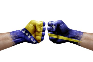 Two hands punch to each others on white background. Country flags painted fists, conflict crisis concept between bosnia and curacao