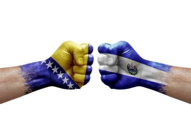 Two hands punch to each others on white background. Country flags painted fists, conflict crisis concept between bosnia and el salvador