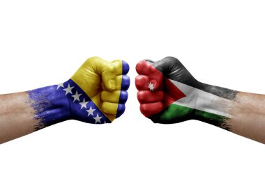 Two hands punch to each others on white background. Country flags painted fists, conflict crisis concept between bosnia and jordan