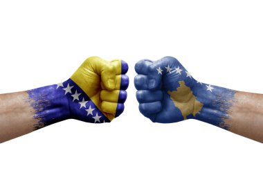 Two hands punch to each others on white background. Country flags painted fists, conflict crisis concept between bosnia and kosovo