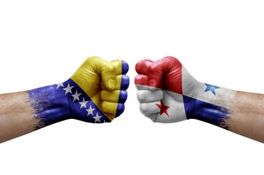 Two hands punch to each others on white background. Country flags painted fists, conflict crisis concept between bosnia and panama
