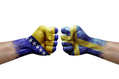 Two hands punch to each others on white background. Country flags painted fists, conflict crisis concept between bosnia and sweden