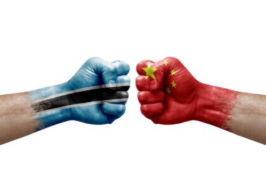 Two hands punch to each others on white background. Country flags painted fists, conflict crisis concept between botswana and china