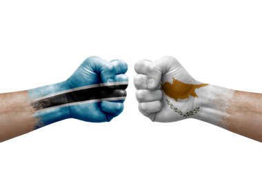 Two hands punch to each others on white background. Country flags painted fists, conflict crisis concept between botswana and cyprus
