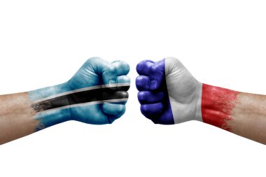 Two hands punch to each others on white background. Country flags painted fists, conflict crisis concept between botswana and france