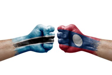 Two hands punch to each others on white background. Country flags painted fists, conflict crisis concept between botswana and laos