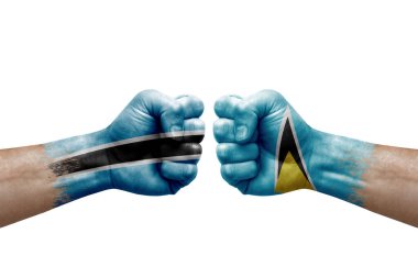 Two hands punch to each others on white background. Country flags painted fists, conflict crisis concept between botswana and saint lucia