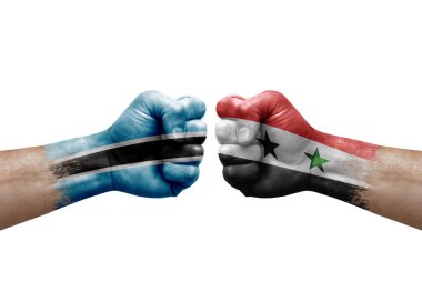 Two hands punch to each others on white background. Country flags painted fists, conflict crisis concept between botswana and syria