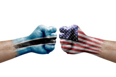 Two hands punch to each others on white background. Country flags painted fists, conflict crisis concept between botswana and usa