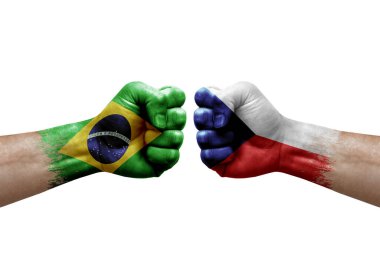 Two hands punch to each others on white background. Country flags painted fists, conflict crisis concept between brazil and czechia