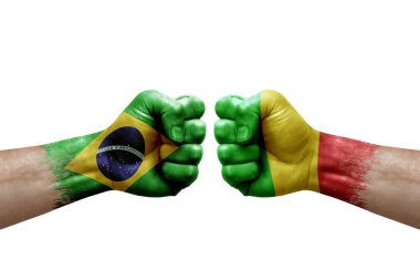 Two hands punch to each others on white background. Country flags painted fists, conflict crisis concept between brazil and mali