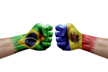 Two hands punch to each others on white background. Country flags painted fists, conflict crisis concept between brazil and moldova