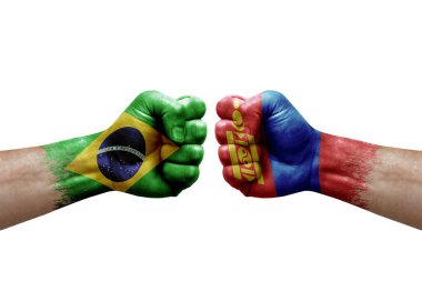 Two hands punch to each others on white background. Country flags painted fists, conflict crisis concept between brazil and mongolia