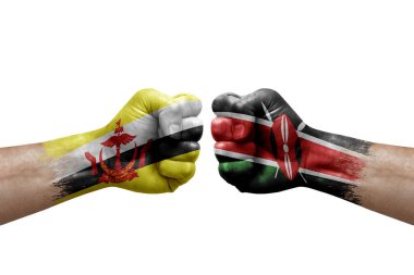 Two hands punch to each others on white background. Country flags painted fists, conflict crisis concept between brunei and kenya