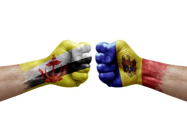 Two hands punch to each others on white background. Country flags painted fists, conflict crisis concept between brunei and moldova