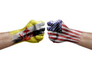 Two hands punch to each others on white background. Country flags painted fists, conflict crisis concept between brunei and usa