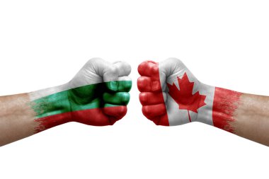Two hands punch to each others on white background. Country flags painted fists, conflict crisis concept between bulgaria and canada