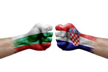 Two hands punch to each others on white background. Country flags painted fists, conflict crisis concept between bulgaria and croatia