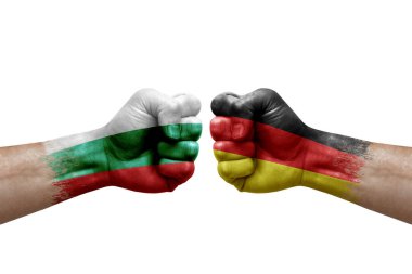 Two hands punch to each others on white background. Country flags painted fists, conflict crisis concept between bulgaria and germany