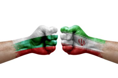 Two hands punch to each others on white background. Country flags painted fists, conflict crisis concept between bulgaria and iran