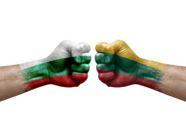 Two hands punch to each others on white background. Country flags painted fists, conflict crisis concept between bulgaria and lithuania