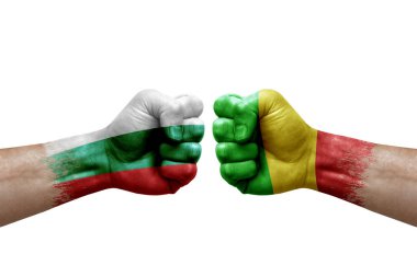 Two hands punch to each others on white background. Country flags painted fists, conflict crisis concept between bulgaria and mali