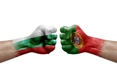 Two hands punch to each others on white background. Country flags painted fists, conflict crisis concept between bulgaria and portugal