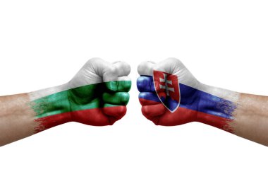 Two hands punch to each others on white background. Country flags painted fists, conflict crisis concept between bulgaria and slovakia
