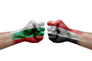 Two hands punch to each others on white background. Country flags painted fists, conflict crisis concept between bulgaria and syria