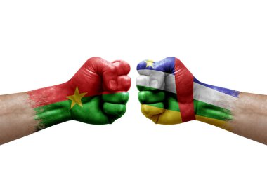 Two hands punch to each others on white background. Country flags painted fists, conflict crisis concept between burkina faso and central african republic