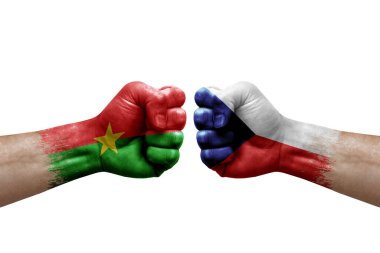 Two hands punch to each others on white background. Country flags painted fists, conflict crisis concept between burkina faso and czechia