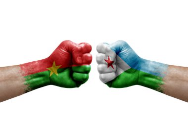 Two hands punch to each others on white background. Country flags painted fists, conflict crisis concept between burkina faso and djibouti