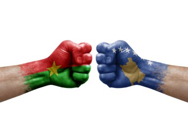 Two hands punch to each others on white background. Country flags painted fists, conflict crisis concept between burkina faso and kosovo