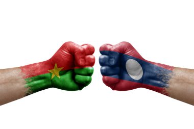 Two hands punch to each others on white background. Country flags painted fists, conflict crisis concept between burkina faso and laos