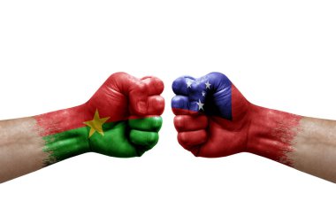 Two hands punch to each others on white background. Country flags painted fists, conflict crisis concept between burkina faso and samoa