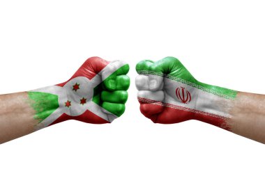 Two hands punch to each others on white background. Country flags painted fists, conflict crisis concept between burundi and iran