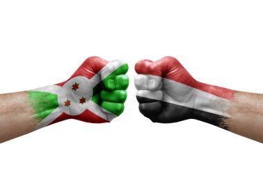 Two hands punch to each others on white background. Country flags painted fists, conflict crisis concept between burundi and yemen