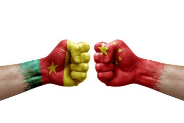 Two hands punch to each others on white background. Country flags painted fists, conflict crisis concept between cameroon and china