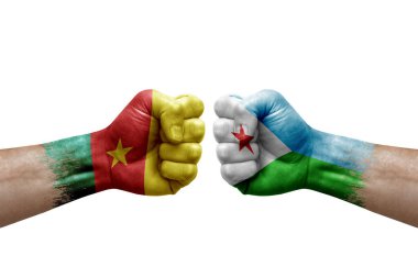 Two hands punch to each others on white background. Country flags painted fists, conflict crisis concept between cameroon and djibouti