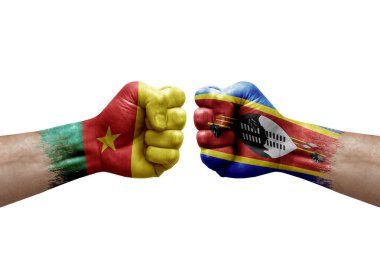 Two hands punch to each others on white background. Country flags painted fists, conflict crisis concept between cameroon and eswatini