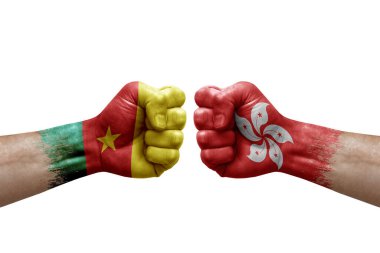 Two hands punch to each others on white background. Country flags painted fists, conflict crisis concept between cameroon and hong kong