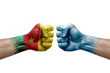 Two hands punch to each others on white background. Country flags painted fists, conflict crisis concept between cameroon and micronesia