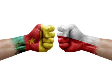 Two hands punch to each others on white background. Country flags painted fists, conflict crisis concept between cameroon and poland