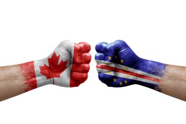 Two hands punch to each others on white background. Country flags painted fists, conflict crisis concept between canada and cape verde