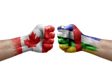Two hands punch to each others on white background. Country flags painted fists, conflict crisis concept between canada and central african republic