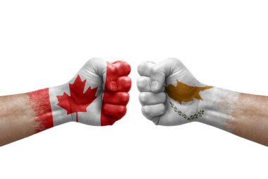 Two hands punch to each others on white background. Country flags painted fists, conflict crisis concept between canada and cyprus
