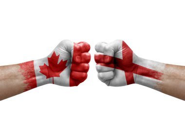 Two hands punch to each others on white background. Country flags painted fists, conflict crisis concept between canada and england
