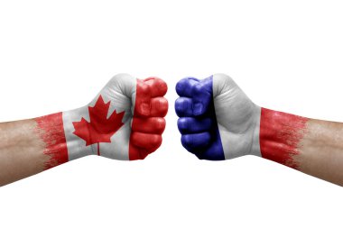 Two hands punch to each others on white background. Country flags painted fists, conflict crisis concept between canada and france