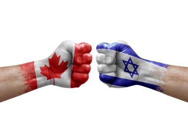 Two hands punch to each others on white background. Country flags painted fists, conflict crisis concept between canada and israel