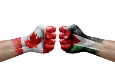 Two hands punch to each others on white background. Country flags painted fists, conflict crisis concept between canada and jordan